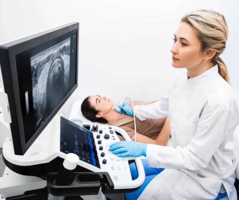 A patient having ultrasound check by a specialist.