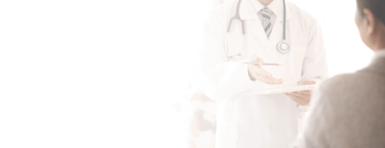 A doctor explaining his findings on his tablet to a patient.