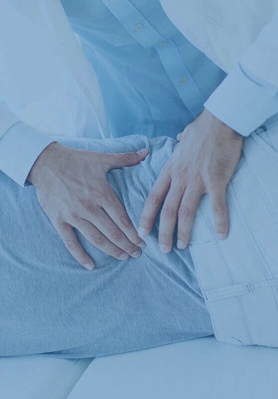 An elderly man receiving care in his lower back by a chiropractor while lying on his side.