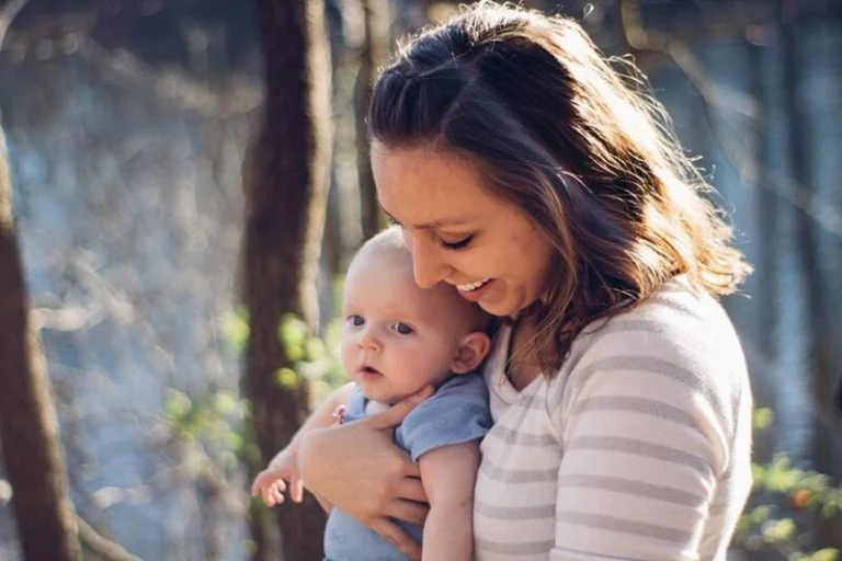 A woman holding her baby.