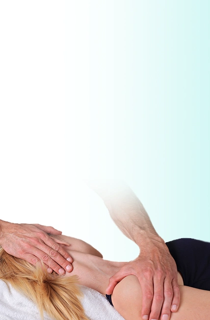 A female patient lying face up and getting stretched in the neck and shoulder area by a chiropractor.