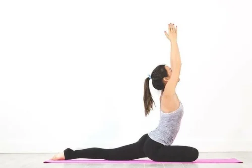 A woman doing a yoga pose.