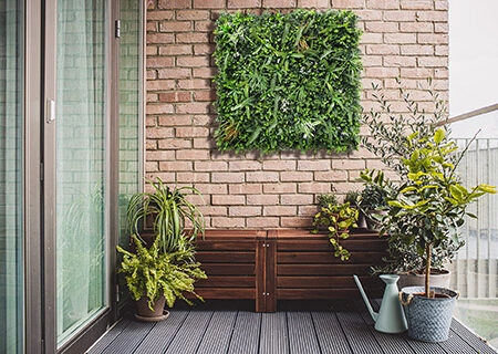 Morden,Residential,Balcony,Garden,With,Bricks,Wall,,Wooden,Bench,And