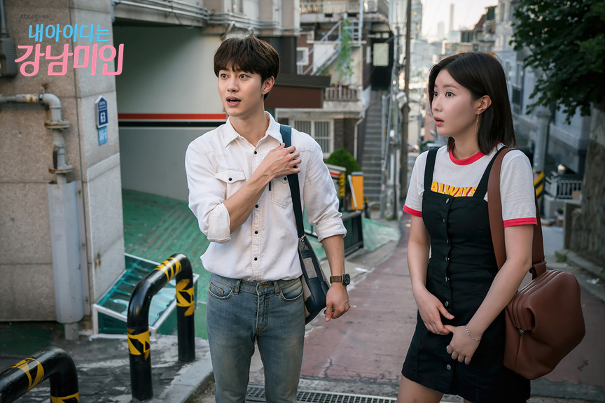 Gangnam beauty Kang Mi Rae black dress with white graphic T-shirt beneath