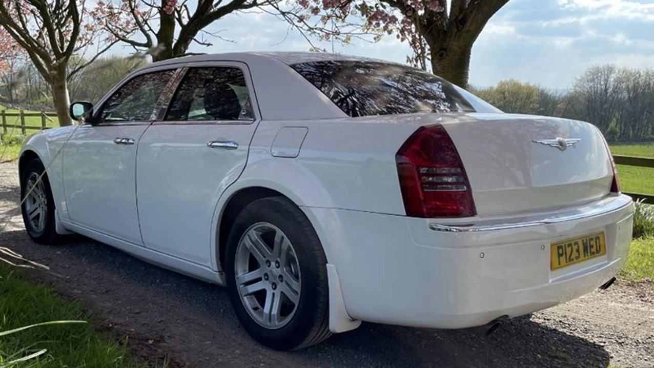 Rear view of Chrysler 300c car in white